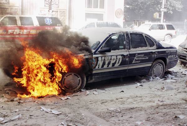 Figure 16. (9/11/01) NYPD vehicle showing thermal damage patterns including melted bands on protective gear, indicating selective heating of conductive materials